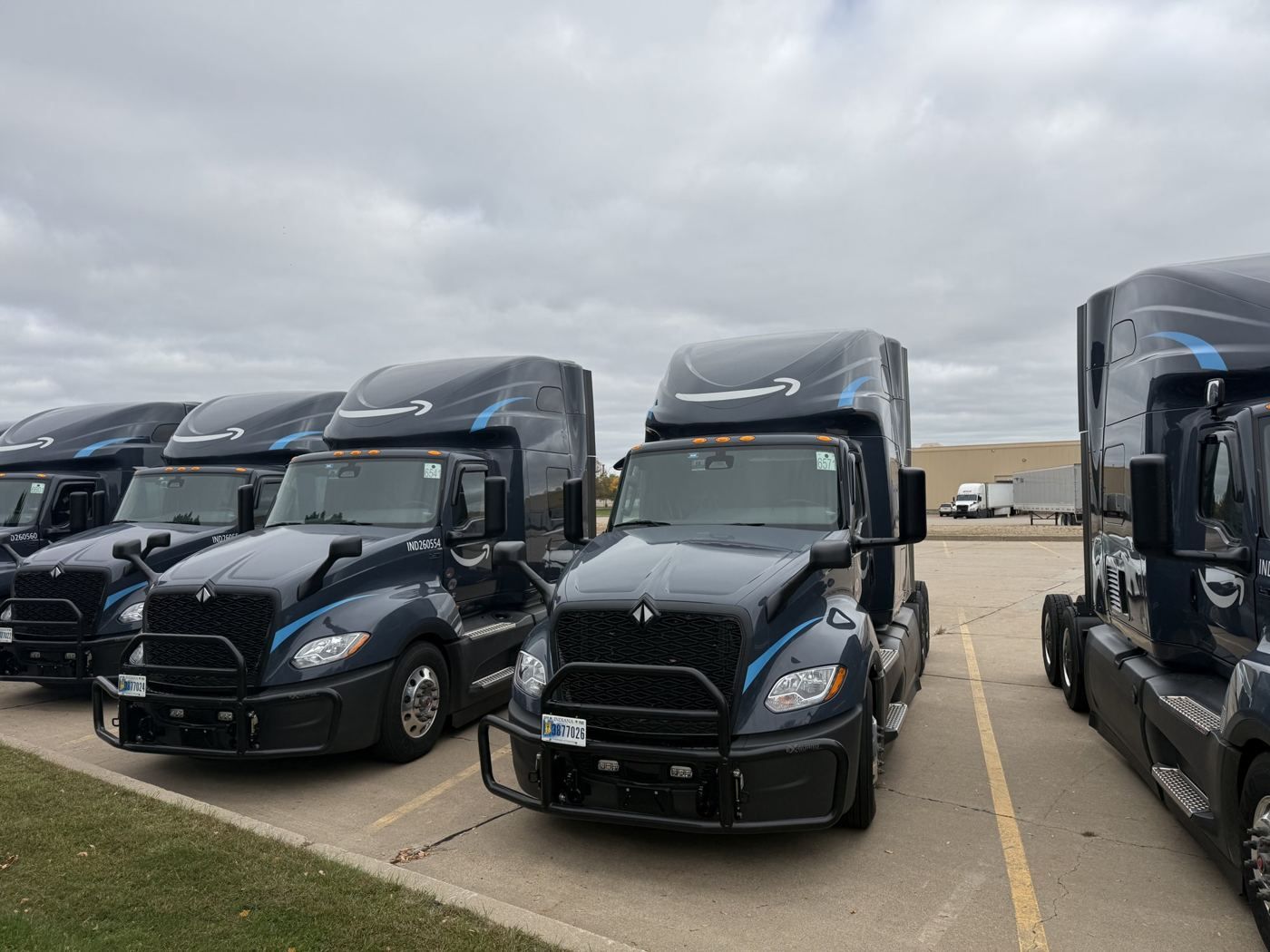 A row of brand-new Sable Freight trucks, seen from the front